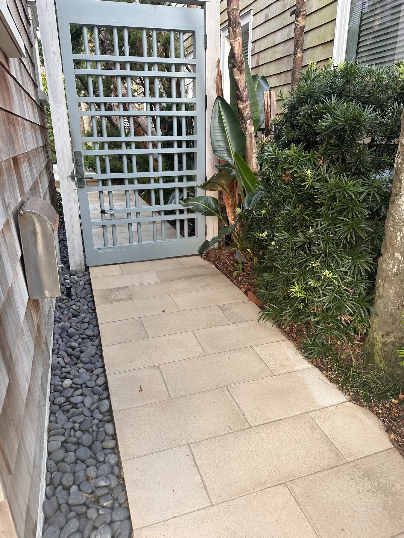 The same walk after, pavers clean to the gate