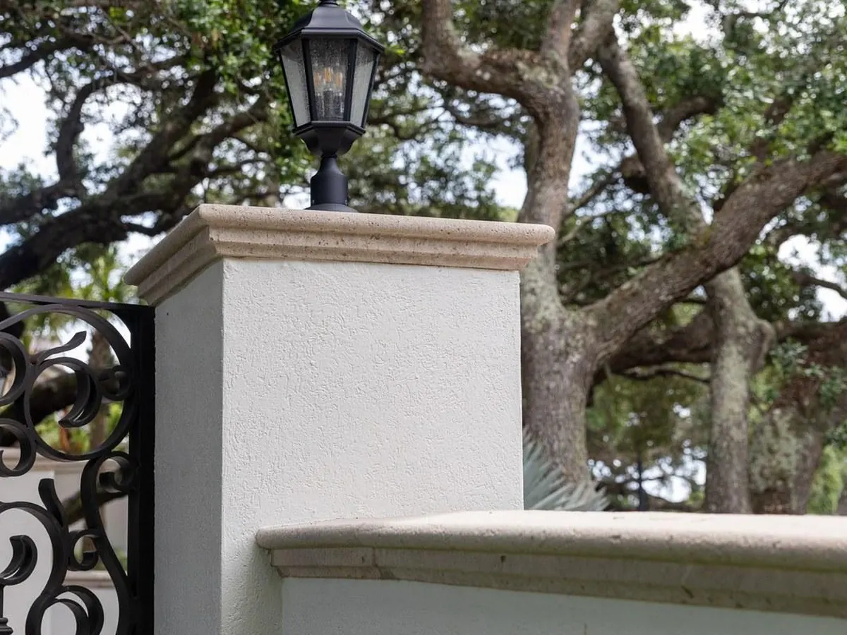 The same stone rail after, detail intact and surface restored