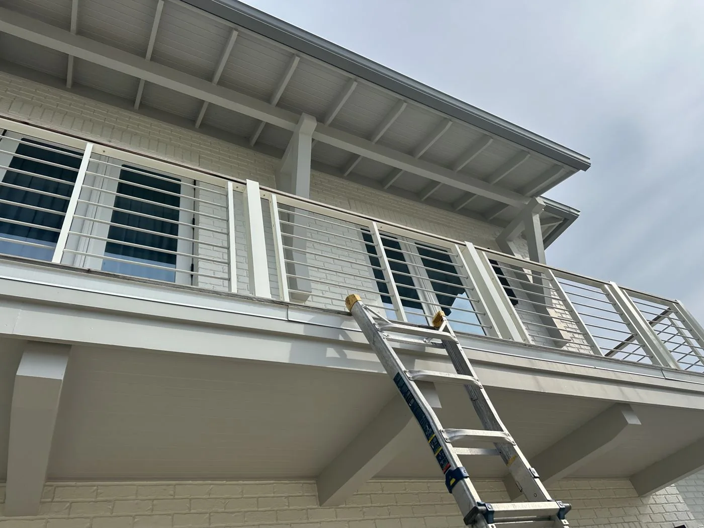 A ladder against the upper balcony