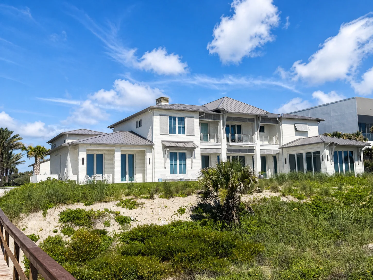 The home seen across the dune